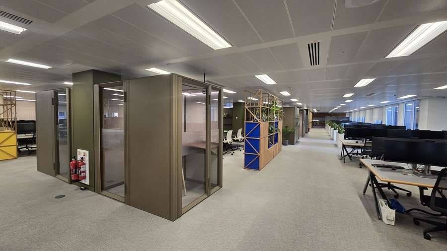 Booths beside open-plan desks