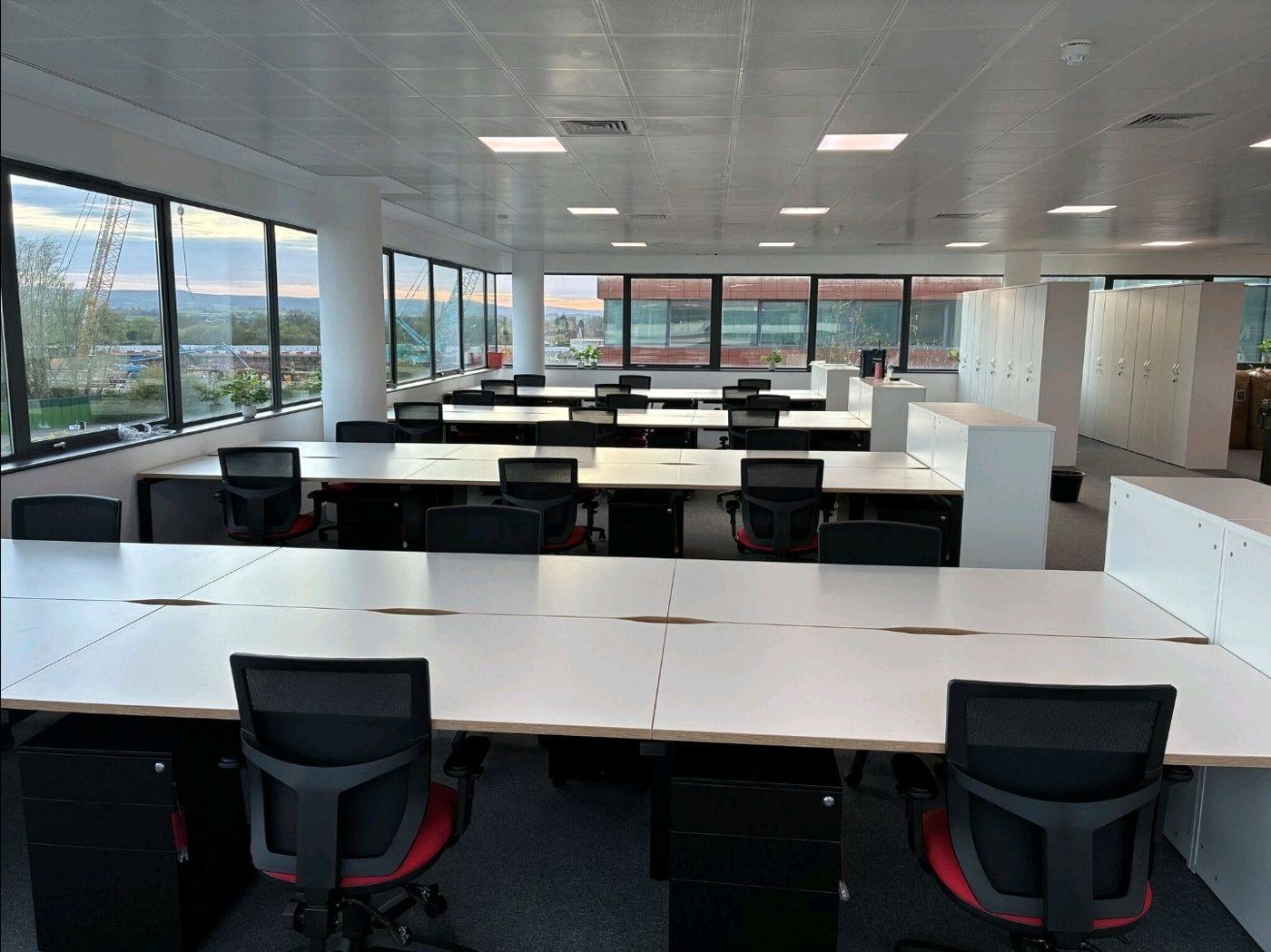 Desk install, open-plan floor
